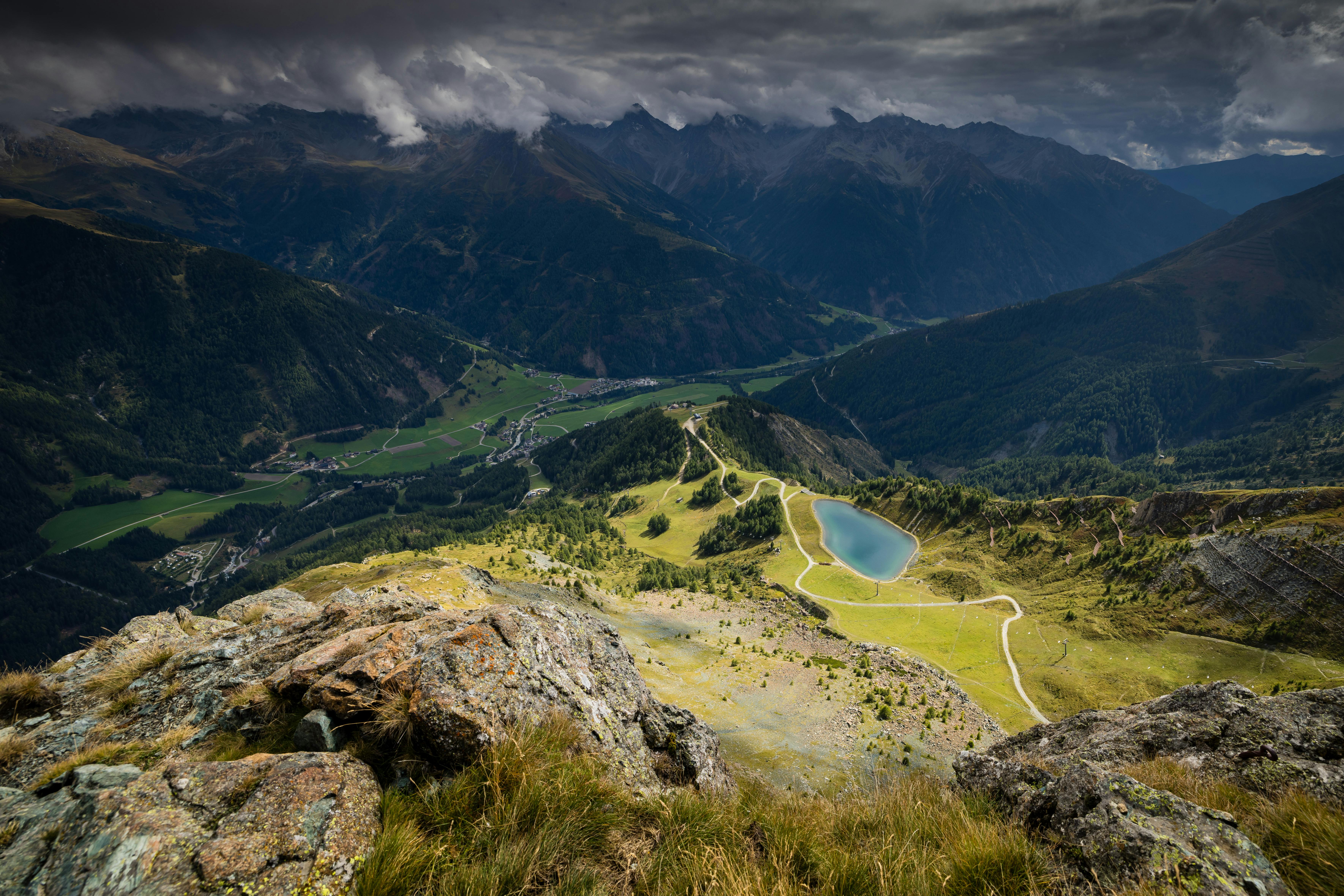 A skier on a pristine white slope with towering Swiss Alps in the background
